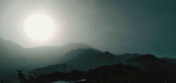 Scenic view of silhouette mountains against sky