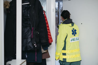 Ambulance staff coming to patient's home