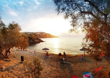 Scenic view of beach against sky during sunset