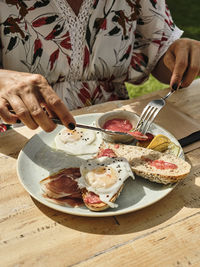 Midsection of person preparing food on table