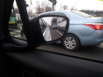 Cars on road seen through car windshield