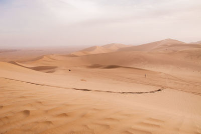 Scenic view of desert against sky