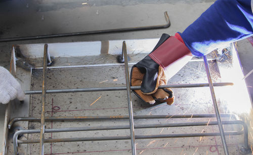 Low section of woman wearing high heels on staircase