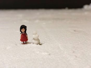 Figurines on snow