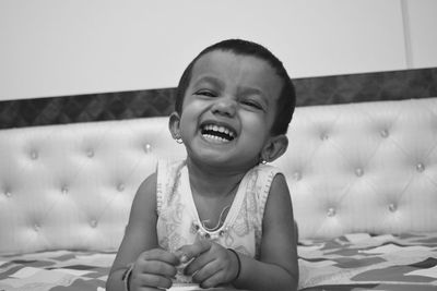 Portrait of cute cheerful girl at home