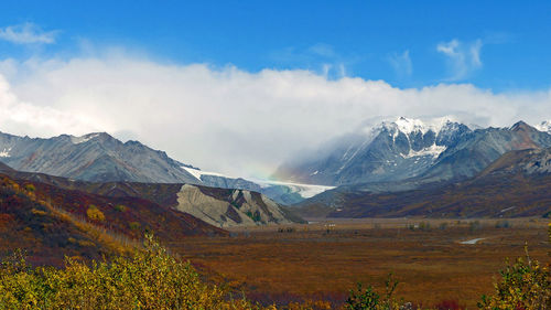 Glacier with rainbow in autumn colors