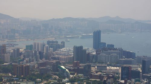 High angle view of city and buildings against sky