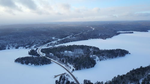 Scenic view of snow covered landscape against sky