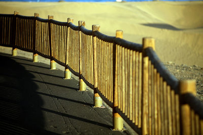 Metal fence by bridge