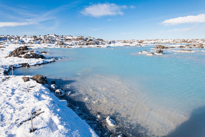 Scenic view of sea against sky during winter