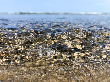 Surface level of sea against sky