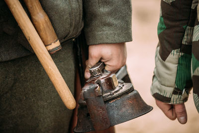 Low section of soldiers cutting metal