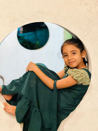 High angle view of young woman standing in tent