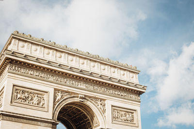 Low angle view of triumphal arch against sky