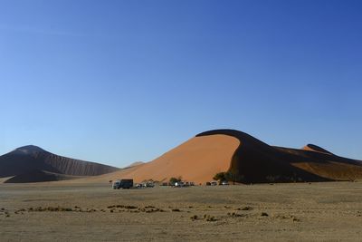 View of desert against blue sky