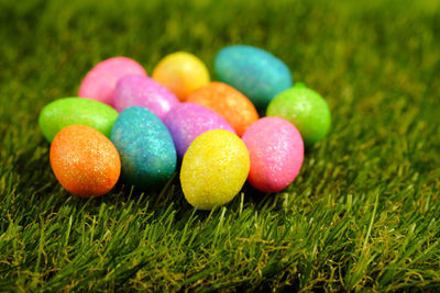 Close-up of multi colored eggs in lawn