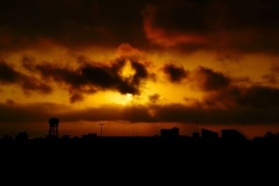 Silhouette of building at sunset