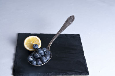 Close-up of banana on table against white background