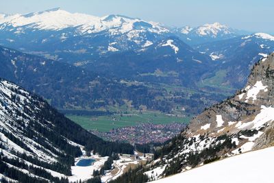 Aerial view of snowcapped mountains against sky