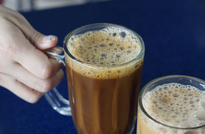 Malaysian coffee in mugs with bubble foam on top
