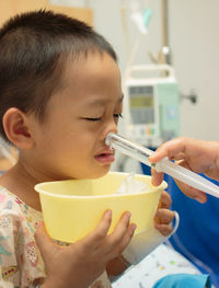 Close-up portrait of boy eating food