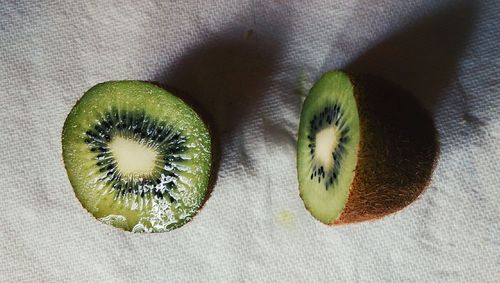 Directly above shot of halved kiwi fruits