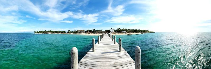 View of jetty leading to sea