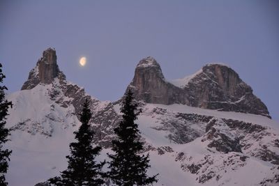 Scenic view of snowcapped mountains against clear sky