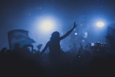 Silhouette of crowd at music festival