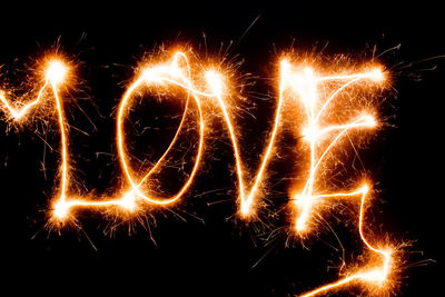 Close-up of illuminated text over black background
