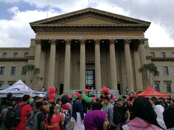 Group of people in front of building