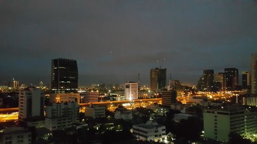 Aerial view of city lit up at night