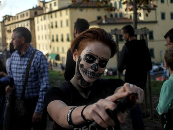 Portrait of people on street in city