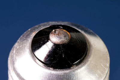 High angle view of black coffee against blue background