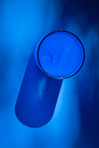 Close-up of blue glass on table
