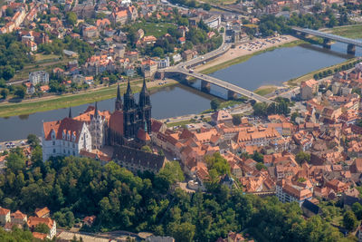 High angle view of buildings and bridge in city