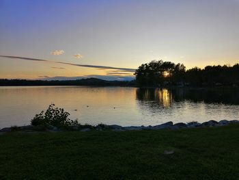 Scenic view of lake against sky during sunset