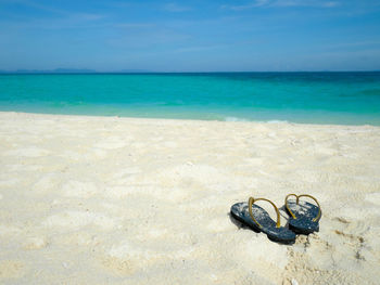 High angle view of shoes on beach