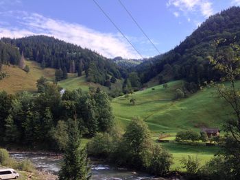 Scenic view of landscape against cloudy sky