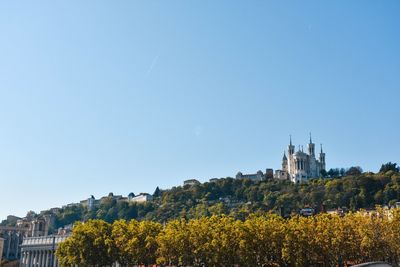 View of cityscape against clear sky