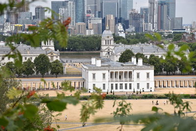 Buildings in city against sky