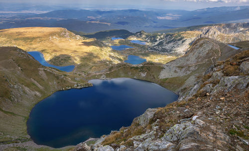 High angle view of lake amidst mountains