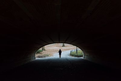 People walking in tunnel