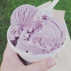 Close-up of hand holding ice cream