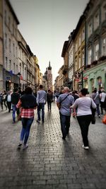 People walking on street in city