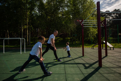 Children playing on slide at playground