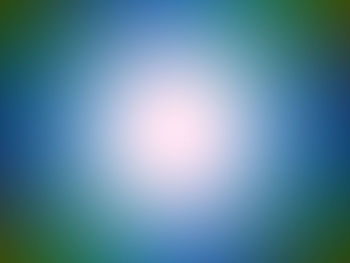 Defocused image of illuminated blue sky