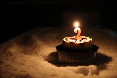 Close-up of candle on birthday cake 