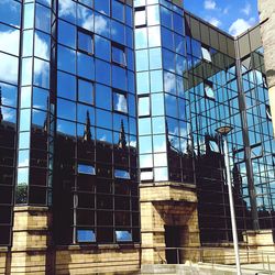 Low angle view of modern building against sky