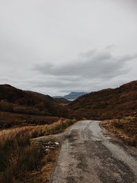 Road amidst landscape against sky